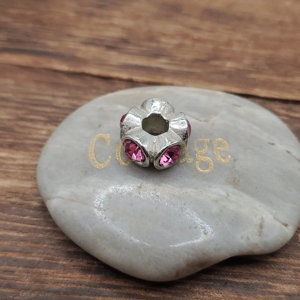 Pink crystal wheel charm‎